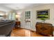 Living room with a wooden floor, and a door to the deck at 108 Summit Walk, Peachtree City, GA 30269