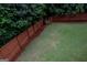 Well-maintained backyard with lush lawn and privacy fence at 8035 Magnolia Way, Roswell, GA 30075