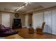 Finished basement offers a seating area with hardwood flooring, comfortable seating, and closet space at 8035 Magnolia Way, Roswell, GA 30075