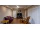 Finished basement offers a seating area with hardwood flooring, comfortable seating, and closet space at 8035 Magnolia Way, Roswell, GA 30075