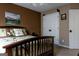 This bedroom is well-lit and has neutral wall color, with dark wood bed frame and doors at 8035 Magnolia Way, Roswell, GA 30075