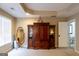 Bedroom with large armoire, mirror, and neutral carpet at 8035 Magnolia Way, Roswell, GA 30075