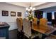 Formal dining room with a large table and elegant chandelier at 8035 Magnolia Way, Roswell, GA 30075