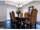 Formal dining room boasts a chandelier, hardwood floors and space for entertaining at 8035 Magnolia Way, Roswell, GA 30075