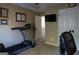 Home gym with a treadmill, TV, and a window, creating a functional and motivating workout space at 8035 Magnolia Way, Roswell, GA 30075