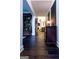 Elegant hallway features hardwood floors and beautiful decor at 8035 Magnolia Way, Roswell, GA 30075