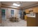 An eat-in kitchen featuring tile flooring, a ceiling fan, and stainless steel appliances at 8035 Magnolia Way, Roswell, GA 30075