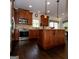 Gourmet kitchen features stainless steel appliances, granite countertops, and a center island at 8035 Magnolia Way, Roswell, GA 30075