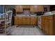 This well-maintained kitchen is equipped with tile flooring, white countertops, and wooden cabinets at 8035 Magnolia Way, Roswell, GA 30075