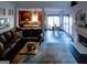 Spacious living room connects to kitchen/dining area, featuring a fireplace at 8035 Magnolia Way, Roswell, GA 30075