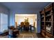 Open-concept living space with view of dining room and hardwood floors at 8035 Magnolia Way, Roswell, GA 30075