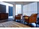 Cozy seating area with plush armchairs and dark, rich hardwood flooring at 8035 Magnolia Way, Roswell, GA 30075