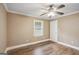 Bedroom with wood floors, a ceiling fan, and a window at 1854 Shadydale Se Ave, Atlanta, GA 30315