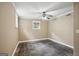 Bedroom featuring stone tile flooring, a ceiling fan, and a window with natural light at 1854 Shadydale Se Ave, Atlanta, GA 30315