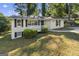 Inviting two-story home with a well-maintained yard and a classic white picket fence at 1854 Shadydale Se Ave, Atlanta, GA 30315