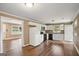 Efficient kitchen with modern appliances, white cabinetry, and laminate flooring at 1854 Shadydale Se Ave, Atlanta, GA 30315