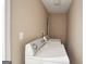 Laundry area showcasing a white washer and dryer, and neutral painted walls at 1854 Shadydale Se Ave, Atlanta, GA 30315