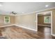 Open-concept living room showcasing laminate floors and access to other rooms at 1854 Shadydale Se Ave, Atlanta, GA 30315