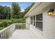 Relaxing outdoor patio featuring a white railing and scenic views of the surrounding greenery at 1854 Shadydale Se Ave, Atlanta, GA 30315