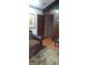Living room with wood paneling and view of another room at 1058 Viking Dr, Stone Mountain, GA 30083