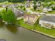 A birds-eye view of the property, highlighting its serene canal-side location, backyard and neighborhood at 105 Providence Ct, Carrollton, GA 30116