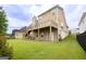 Expansive backyard featuring a wooden deck, providing a serene outdoor space for relaxation and entertainment at 105 Providence Ct, Carrollton, GA 30116