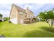 Spacious backyard with lush green lawn, wooden deck and canal for outdoor enjoyment at 105 Providence Ct, Carrollton, GA 30116