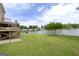 Sprawling backyard with lush grass and a serene lake view at 105 Providence Ct, Carrollton, GA 30116