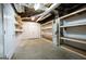 Unfinished basement showing the HVAC system and built in shelving at 105 Providence Ct, Carrollton, GA 30116