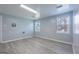 Finished basement features durable plank flooring, natural light, and multiple windows at 105 Providence Ct, Carrollton, GA 30116