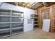 Unfinished basement space offers ample storage solutions with shelving and a cabinet at 105 Providence Ct, Carrollton, GA 30116