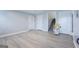 Finished basement features durable plank flooring, chair lift, and access to upstairs at 105 Providence Ct, Carrollton, GA 30116