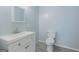 Neutral half bathroom with single sink vanity, hard surface flooring, and modern fixtures at 105 Providence Ct, Carrollton, GA 30116