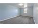 Bedroom featuring a window, neutral walls, and plush carpet flooring at 105 Providence Ct, Carrollton, GA 30116