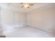 Spacious bedroom with neutral walls, patterned carpet, and a ceiling fan at 105 Providence Ct, Carrollton, GA 30116