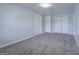 Bedroom featuring neutral walls, plush carpet flooring, and closet at 105 Providence Ct, Carrollton, GA 30116