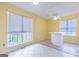 Bright dining area with tile floor, yellow walls, and a bar at 105 Providence Ct, Carrollton, GA 30116