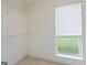 Walk-in closet with carpet, shelving, and window for natural light at 105 Providence Ct, Carrollton, GA 30116
