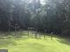 Expansive backyard with a wooden fence and lush greenery, offering privacy at 1744 Campbell Rd, Covington, GA 30014