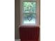 Bright bathroom featuring a window with a heart and a towel rack with a red towel at 1744 Campbell Rd, Covington, GA 30014