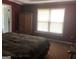 Bedroom features bed, wardrobe, and window with natural light at 1744 Campbell Rd, Covington, GA 30014