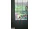 Decorative stained glass window on front door with floral design at 1744 Campbell Rd, Covington, GA 30014