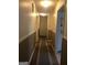 Hallway with rug runner and neutral paint at 1744 Campbell Rd, Covington, GA 30014