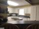 Spacious kitchen with white cabinetry, ample countertop space, and modern appliances at 1744 Campbell Rd, Covington, GA 30014