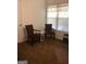 Cozy room showcasing two chairs, a small table, and a window offering natural light at 1744 Campbell Rd, Covington, GA 30014