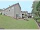 Spacious backyard showcasing a lush lawn and a charming deck with a covered gazebo at 323 Newfield Way, Peachtree City, GA 30269