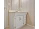 Bathroom vanity with white cabinets and vintage hardware accents at 323 Newfield Way, Peachtree City, GA 30269
