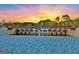 Picturesque Lake Peachtree bridge at sunset, with serene water and vibrant sky at 323 Newfield Way, Peachtree City, GA 30269