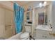 Functional bathroom with a tub and shower, vanity, and storage cabinet at 3570 Keels Ln, Atlanta, GA 30349