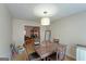 A charming dining room with dark wooden furniture and a view of the living room at 3570 Keels Ln, Atlanta, GA 30349
